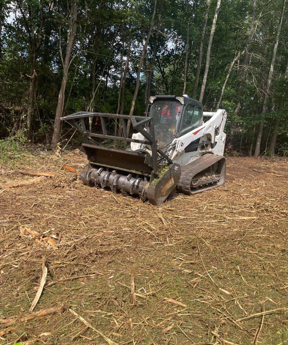 skid steer with a forestry mulching attachment